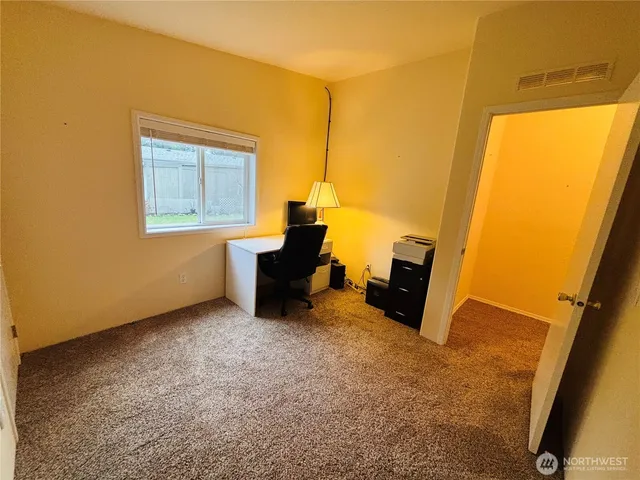 a white toilet sitting next to a shower curtain