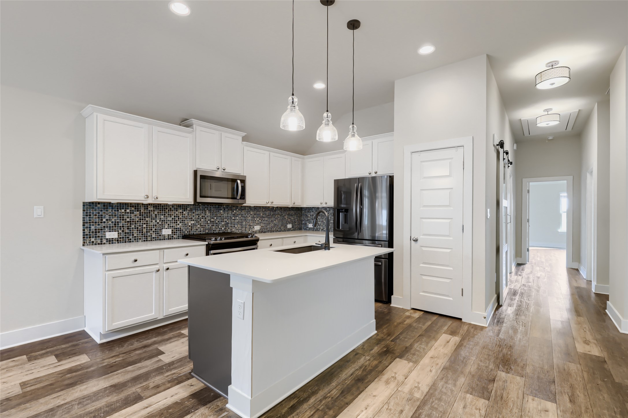 550 Nautical Loop Kyle, TX 78640 - Photo 5 of 29 Custom back-splash (shades of blue) and Samsung refrigerator conveys