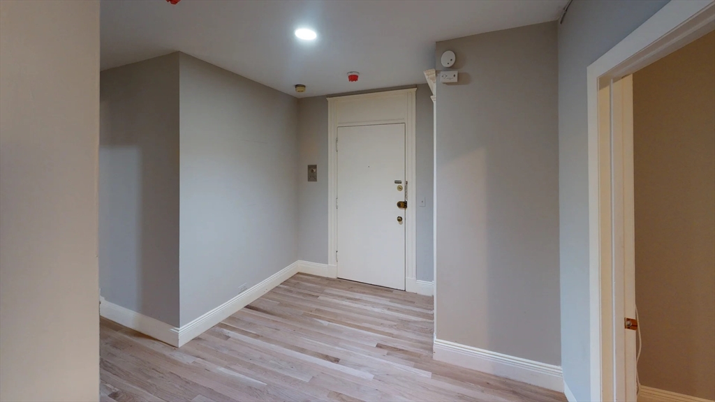 466 Commonwealth Avenue, Unit 406 Boston, MA 02215 - Photo 6 of 8 a view of hallway with wooden floor