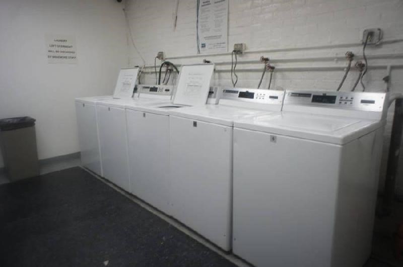 466 Commonwealth Avenue, Unit 406 Boston, MA 02215 - Photo 8 of 8 a utility room with dryer and washer