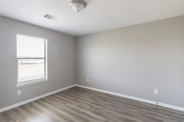 a bathroom with a double vanity sink a mirror and shower