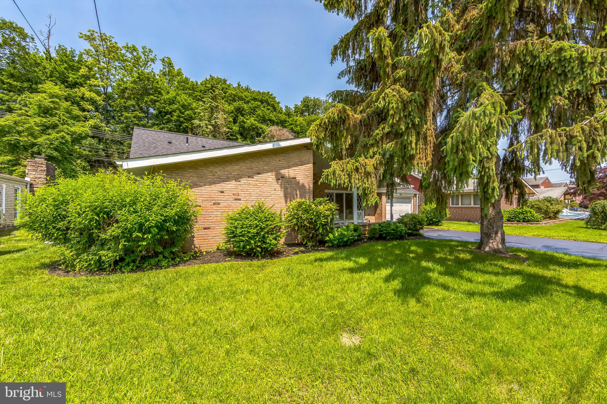 44 South Brookside Road Springfield, PA 19064 - Photo 3 of 30 a view of a yard with plants and trees