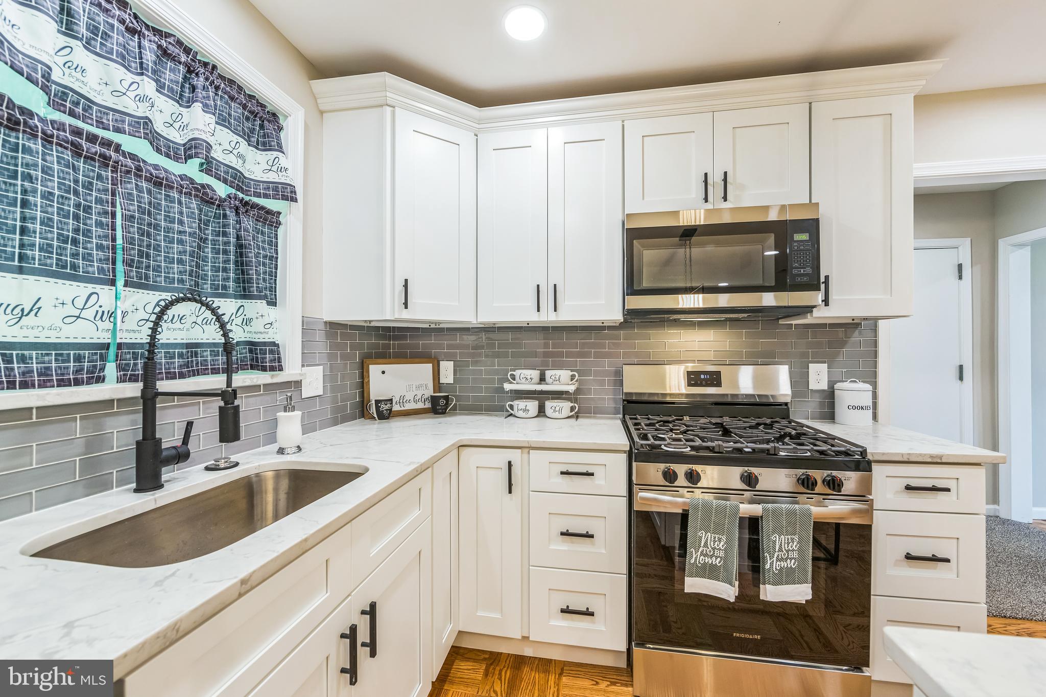 44 South Brookside Road Springfield, PA 19064 - Photo 10 of 30 a kitchen with stainless steel appliances granite countertop a stove and a sink
