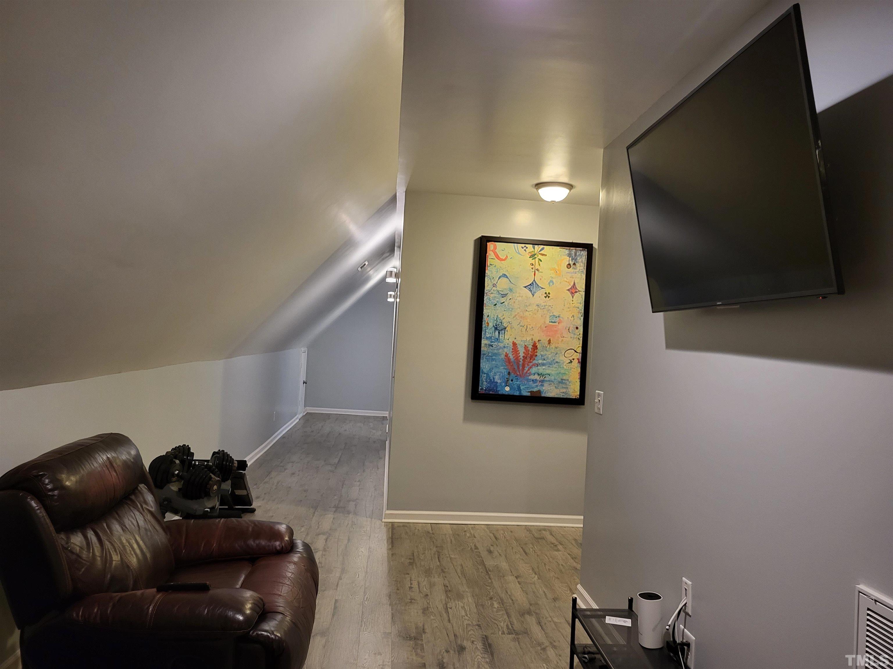 1096 Fire Lane Road Bunnlevel, NC 28323 - Photo 33 of 37 a living room with furniture and a flat screen tv