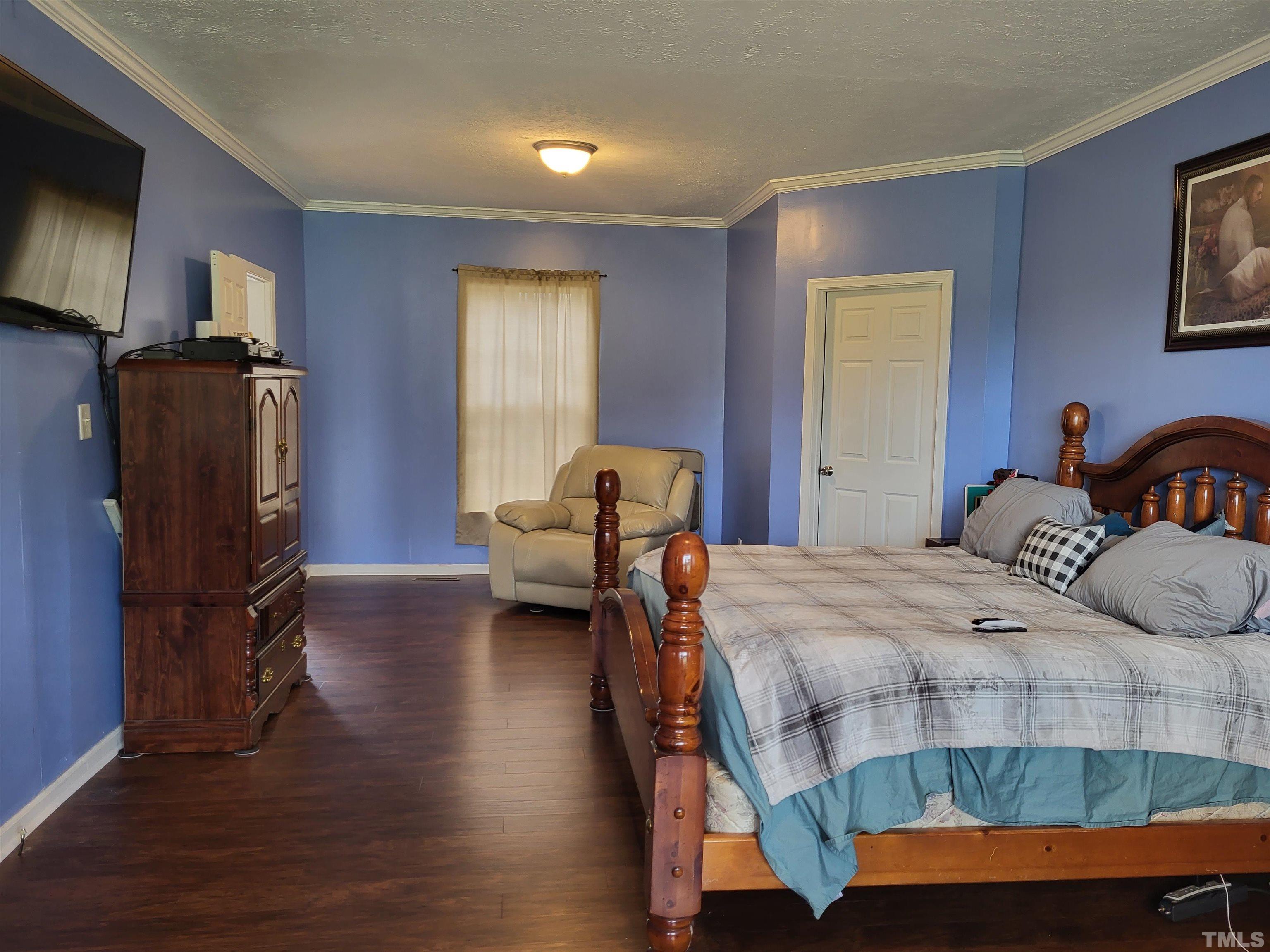 1096 Fire Lane Road Bunnlevel, NC 28323 - Photo 8 of 37 a bedroom with bed and a window