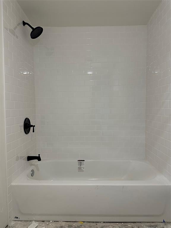 102 North Pinto Street Comanche, TX 76442 - Photo 22 of 23 a bathroom with a bathtub