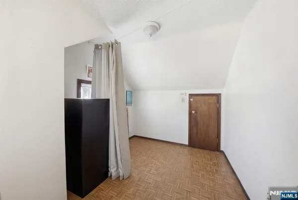 a view of a room with wooden furniture