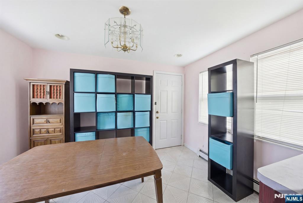 106 Summit Avenue Bloomfield, NJ 07003 - Photo 6 of 18 a living room with furniture a window and bookshelf
