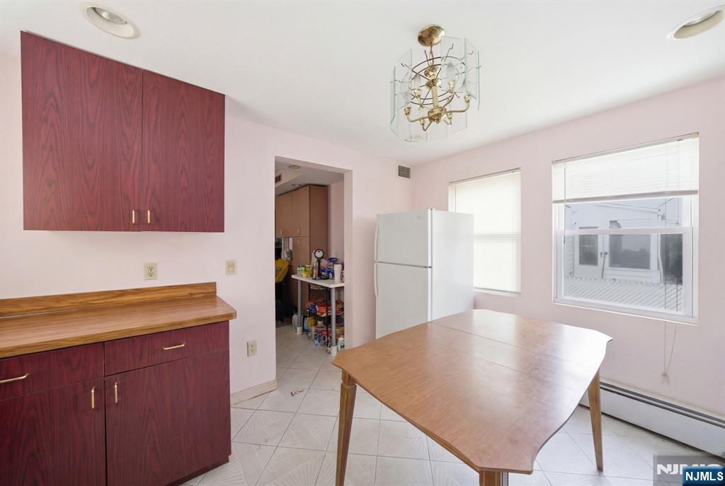 106 Summit Avenue Bloomfield, NJ 07003 - Photo 7 of 18 a kitchen with a table and chairs