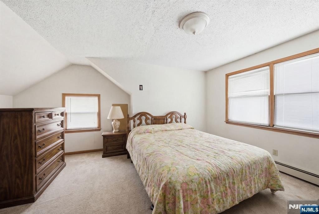 106 Summit Avenue Bloomfield, NJ 07003 - Photo 10 of 18 a bed room with a bed and a window