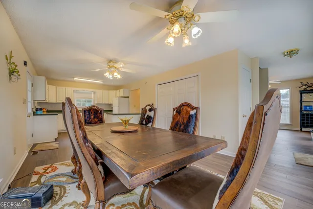 a view of a dining room and livingroom with furniture