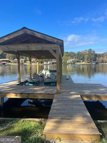 a view of a lake with houses in the background