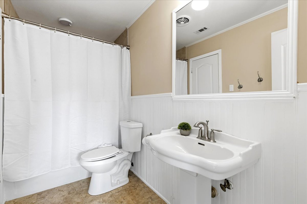12400 Rusted Nail Cove Austin, TX 78750 - Photo 21 of 31 The upstairs full bath is conveniently located between the secondary bedrooms.