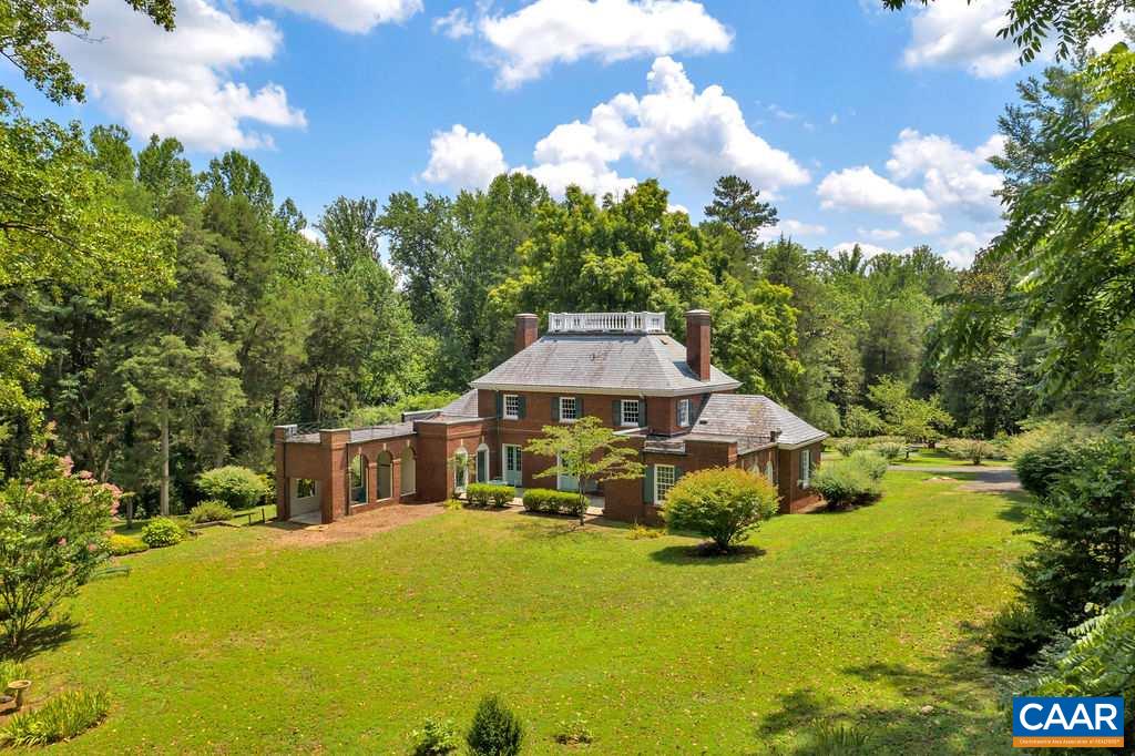 1805 Lake Road Charlottesville, VA 22901 - Photo 6 of 50 a yellow house with trees in front of it