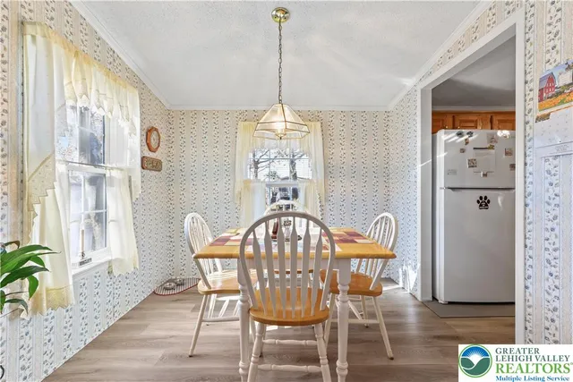 a spacious bedroom with a bed and dresser