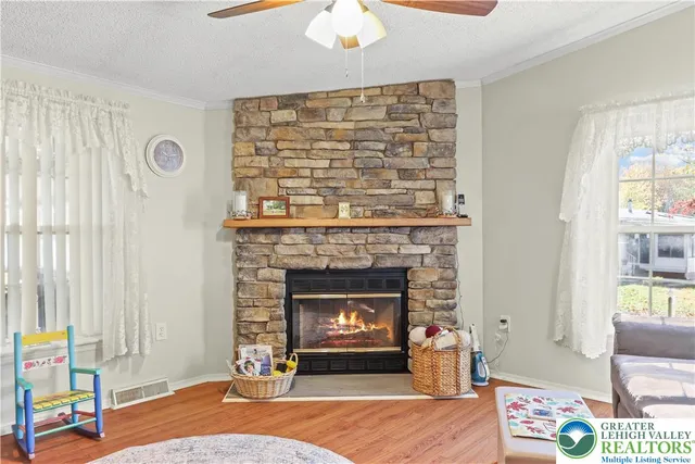 a bathroom with a granite countertop sink a mirror and a shower