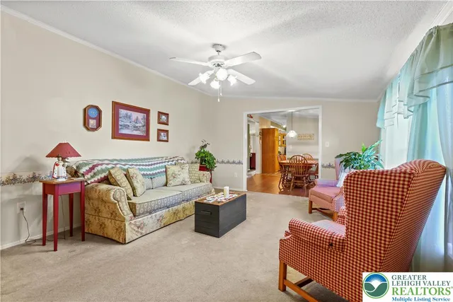 a kitchen with stainless steel appliances granite countertop a refrigerator a stove and a sink with cabinets