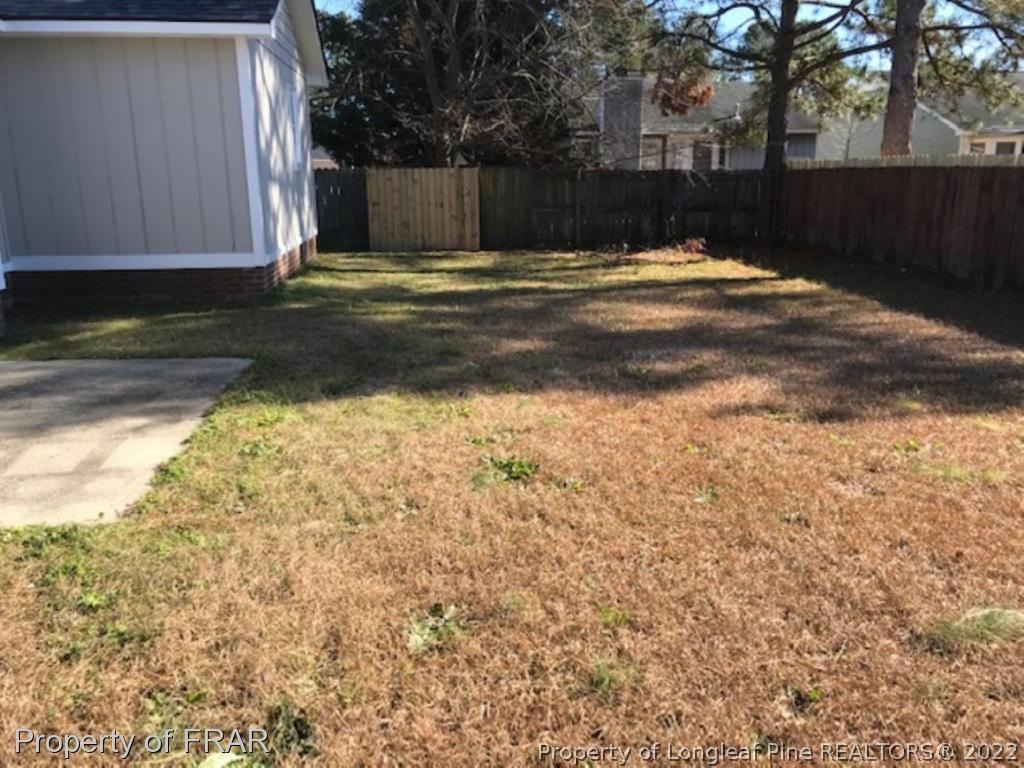 6140 Rhemish Drive Fayetteville, NC 28304 - Photo 11 of 12 a view of a backyard of the house
