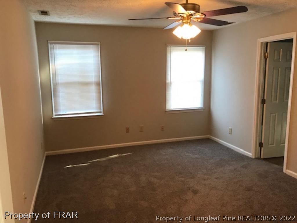 6140 Rhemish Drive Fayetteville, NC 28304 - Photo 5 of 12 a view of an empty room with a window