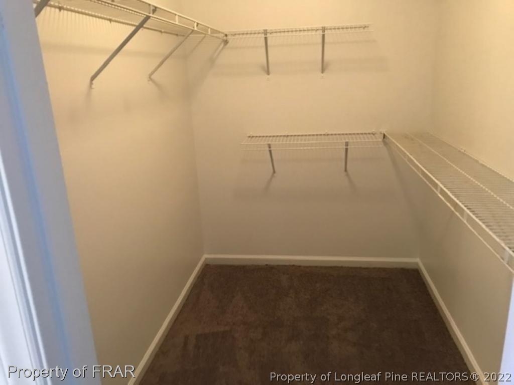6140 Rhemish Drive Fayetteville, NC 28304 - Photo 6 of 12 a view of a room with racks on the wall