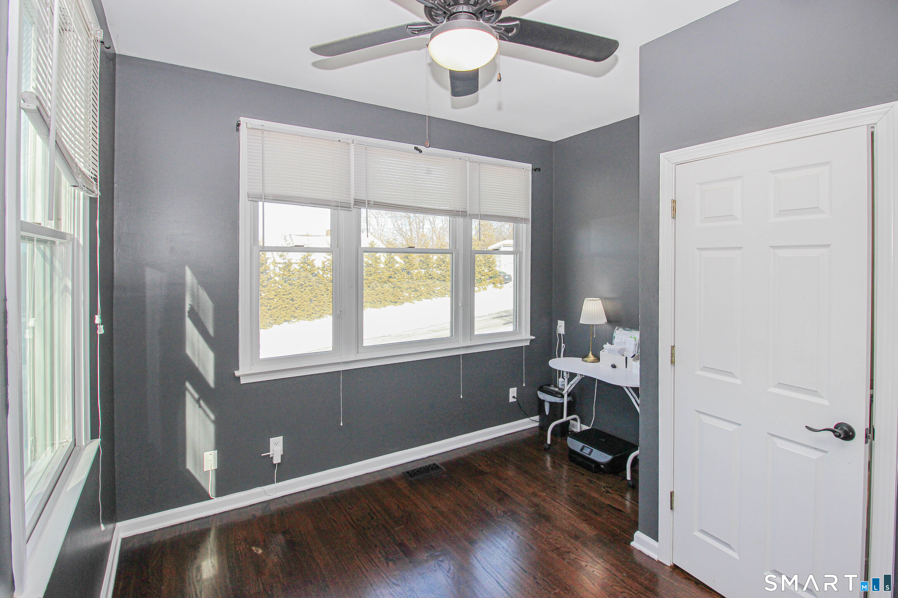 235 Lucille Street Newington, CT 06111 - Photo 13 of 35 a view of a livingroom with a window and wooden floor