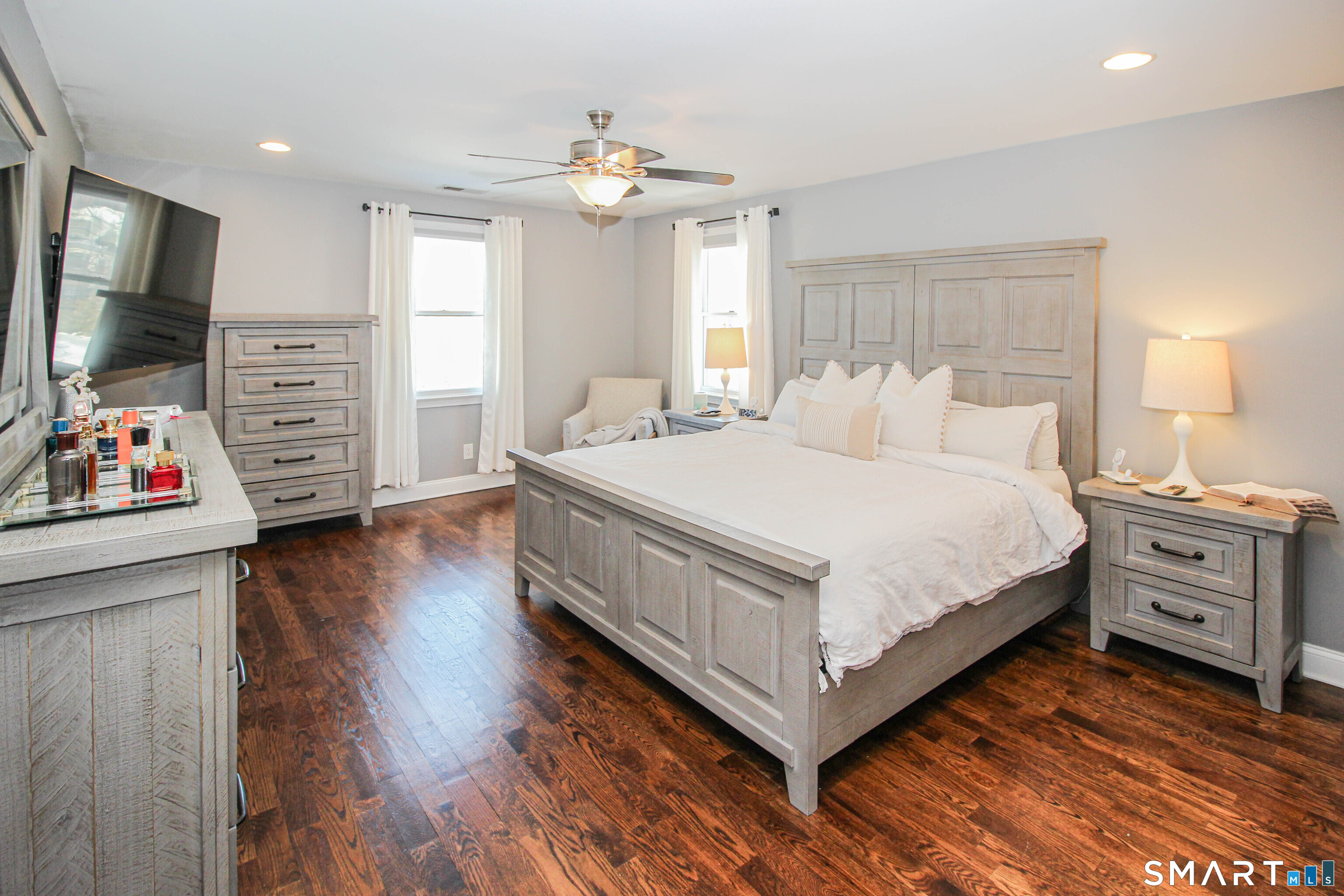 235 Lucille Street Newington, CT 06111 - Photo 22 of 35 a bedroom with a bed and a flat tv screen on dresser