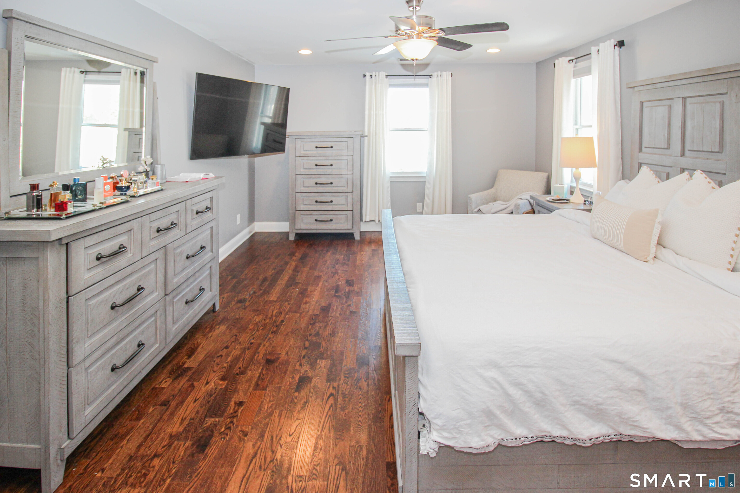 235 Lucille Street Newington, CT 06111 - Photo 23 of 35 a spacious bedroom with a bed and a flat screen tv
