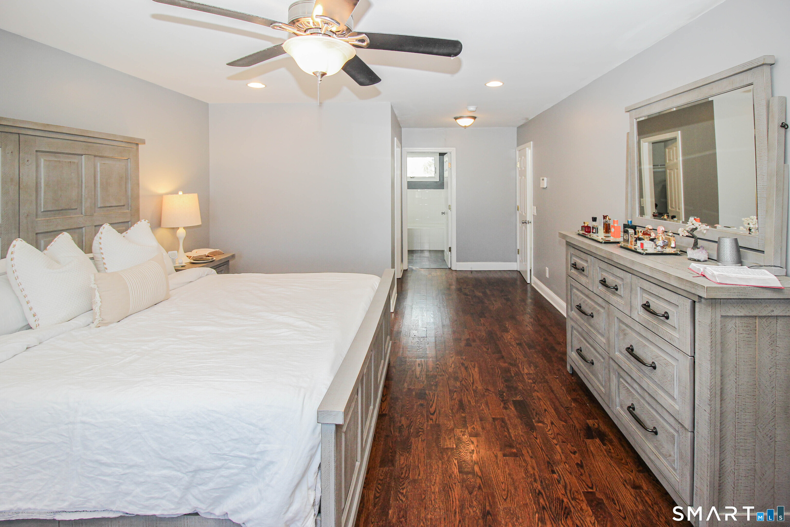 235 Lucille Street Newington, CT 06111 - Photo 24 of 35 a spacious bedroom with a bed and a chandelier