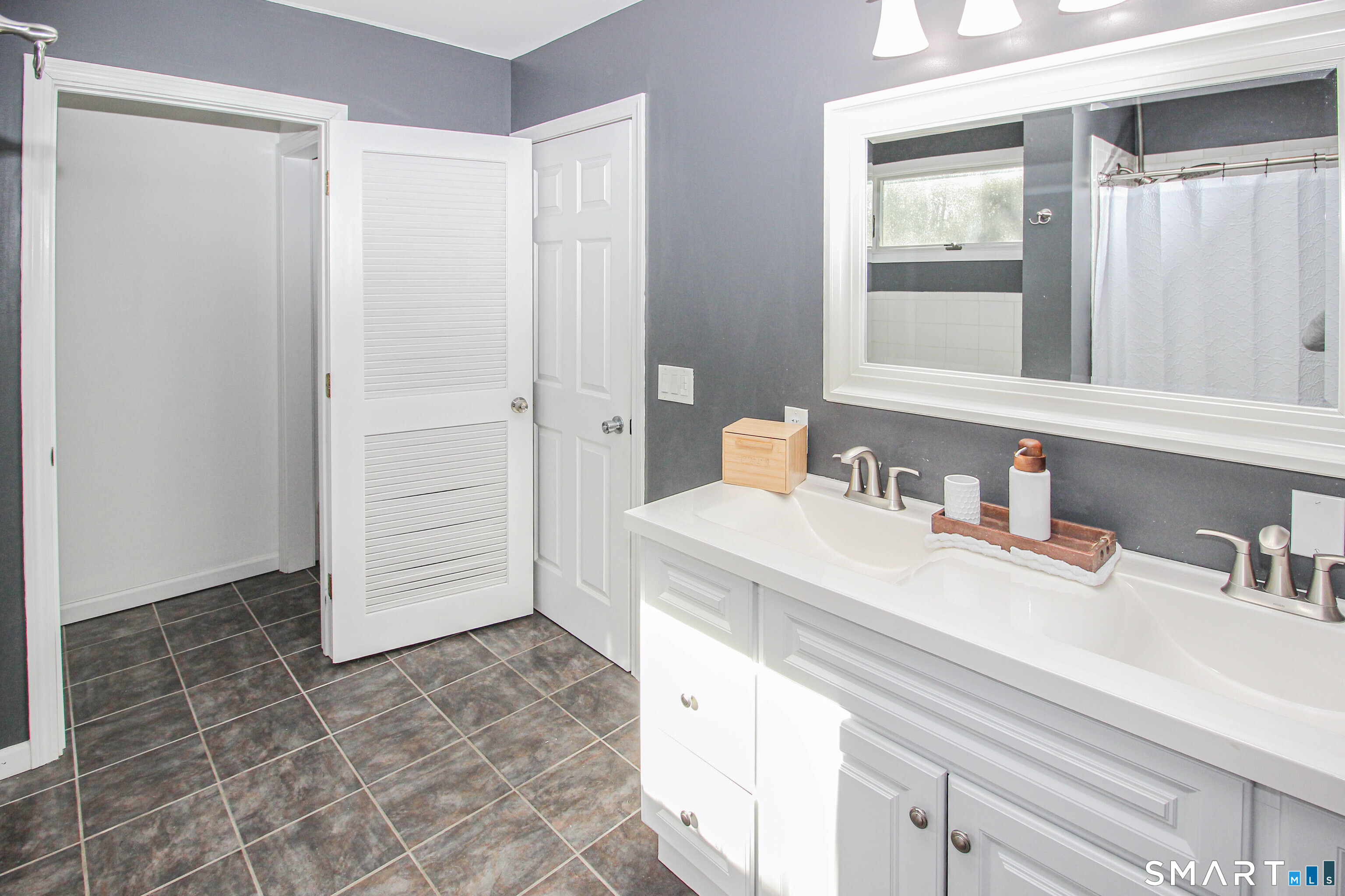 235 Lucille Street Newington, CT 06111 - Photo 26 of 35 a bathroom with a sink vanity and a mirror