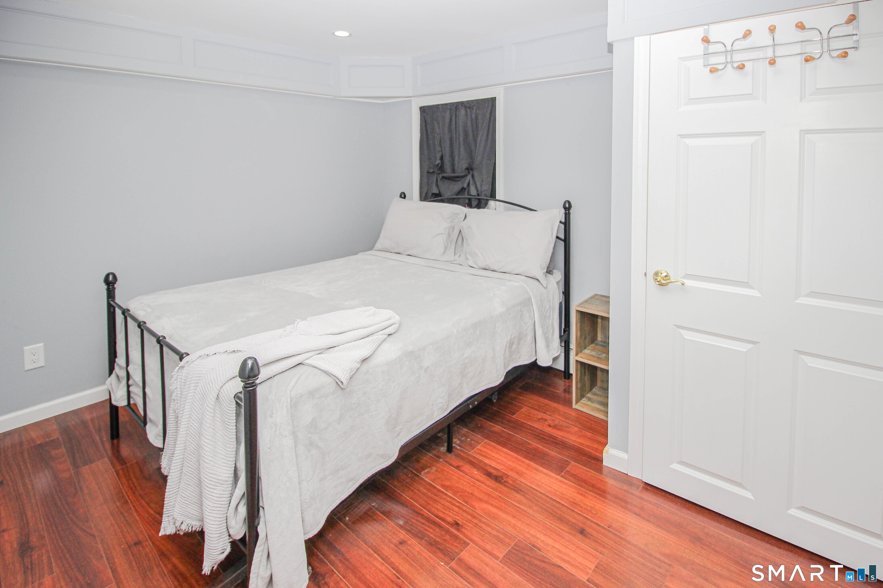 235 Lucille Street Newington, CT 06111 - Photo 31 of 35 a bedroom with a bed and wooden floor