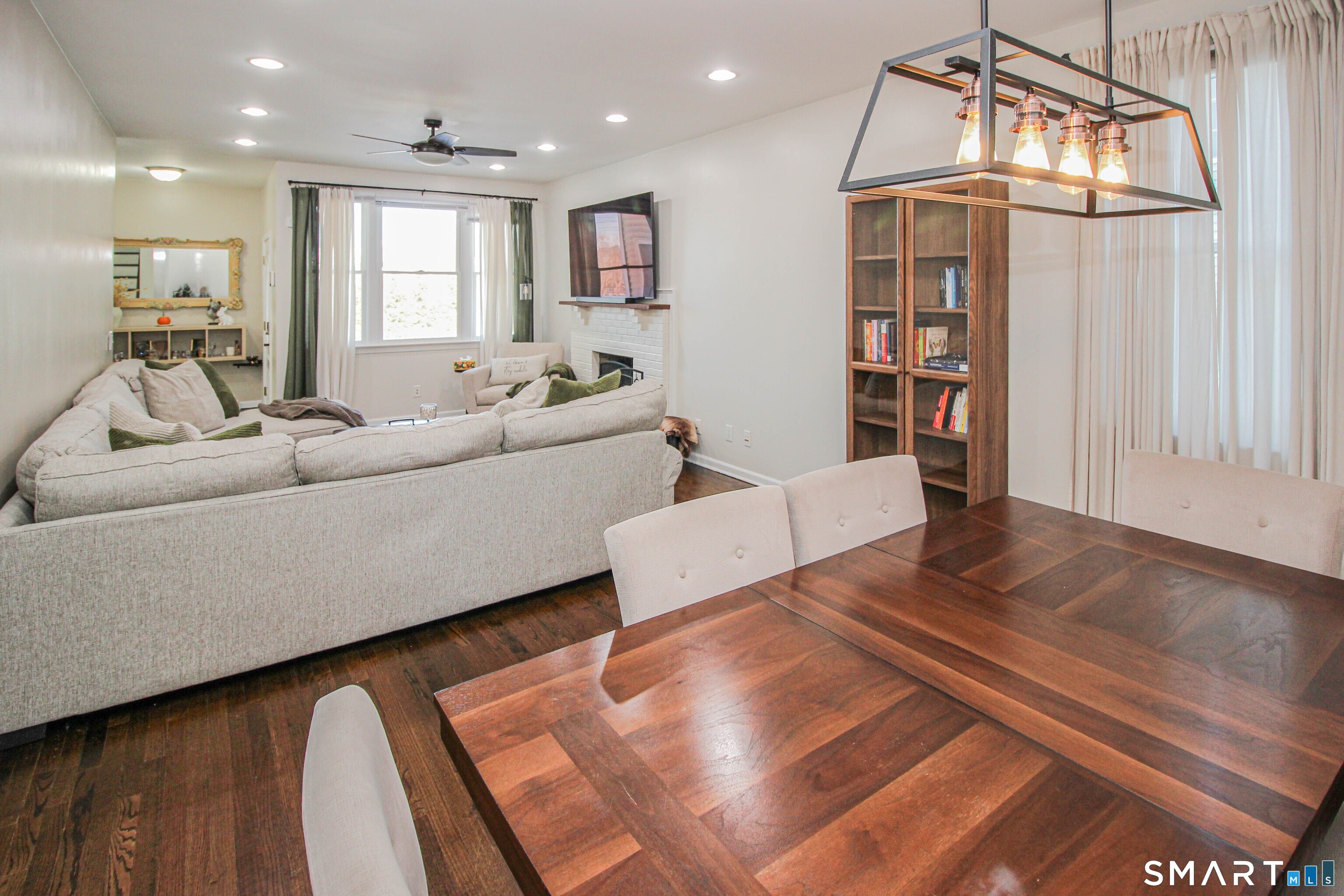 235 Lucille Street Newington, CT 06111 - Photo 7 of 35 a living room with furniture and a chandelier