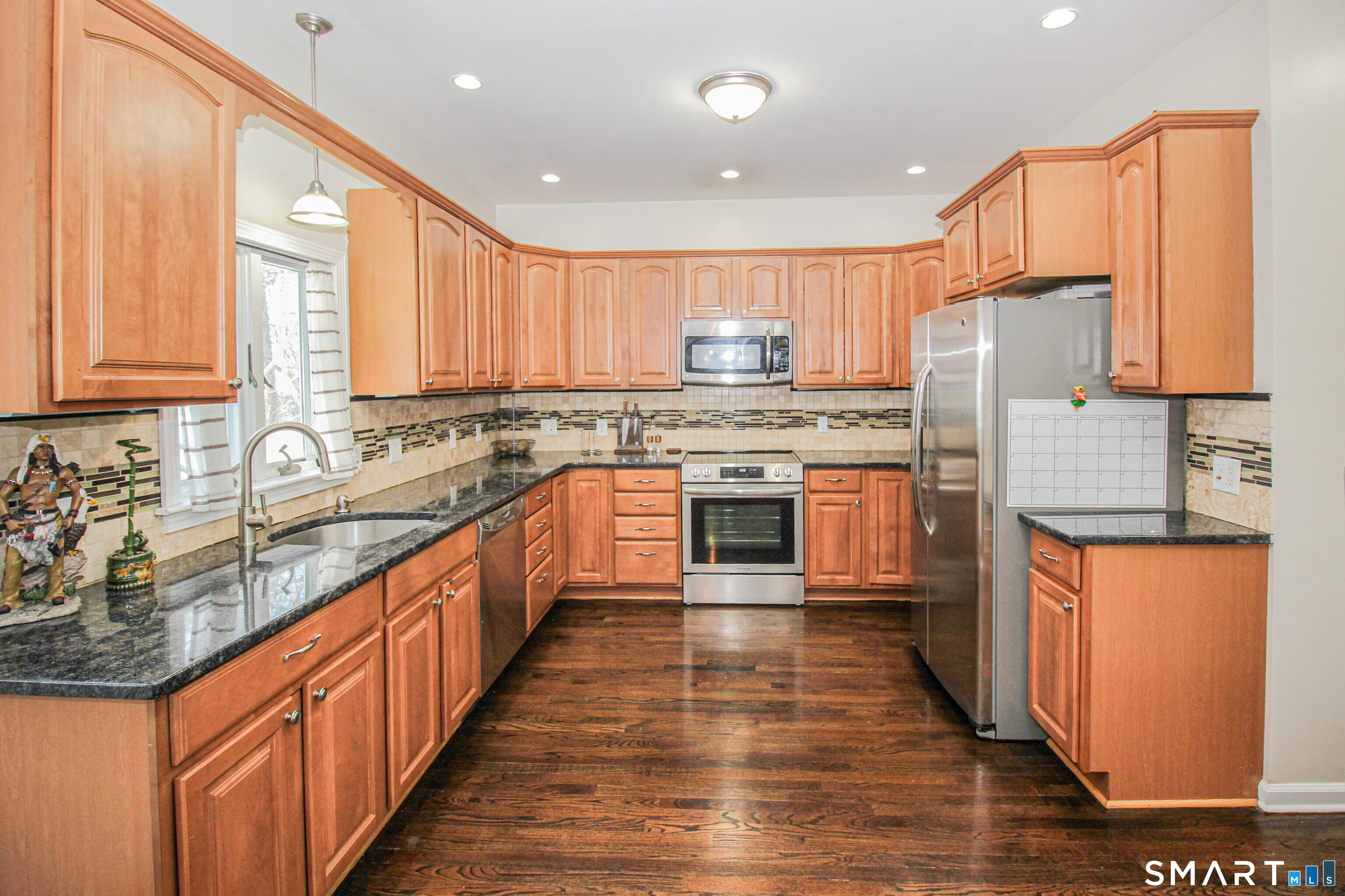 235 Lucille Street Newington, CT 06111 - Photo 10 of 35 a kitchen with stainless steel appliances granite countertop a stove a sink dishwasher and a refrigerator