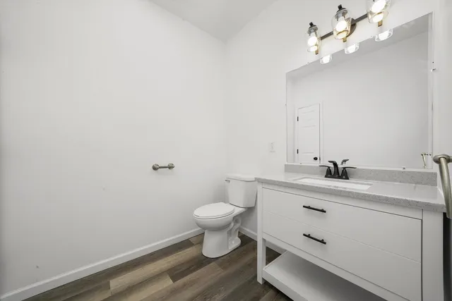 a bathroom with a sink vanity and a mirror