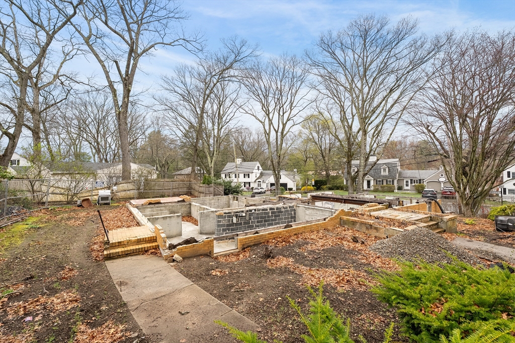 73 Beverly Road Brookline, MA 02467 - Photo 3 of 7 a view of a yard with trees