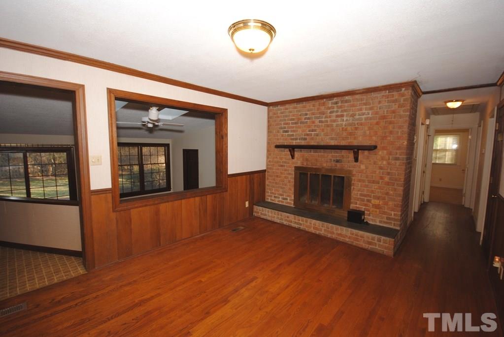 801 Tinkerbell Road Chapel Hill, NC 27517 - Photo 5 of 18 Family room has a masonry fireplace..
