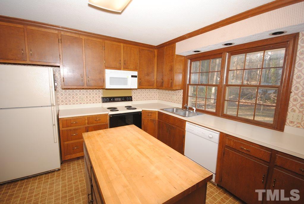 801 Tinkerbell Road Chapel Hill, NC 27517 - Photo 7 of 18 Kitchen has tons of cabinet space and a center island...