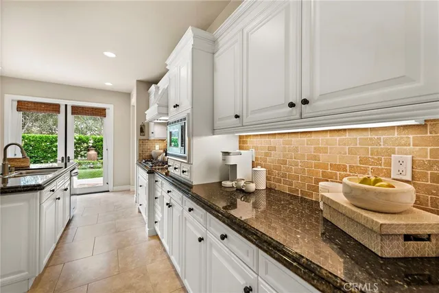 a kitchen with granite countertop lots of counter top space