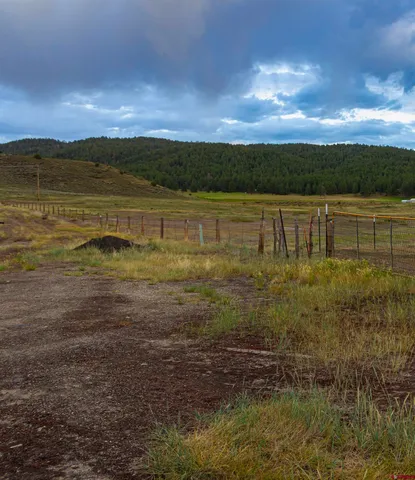 a view of a lake with a yard