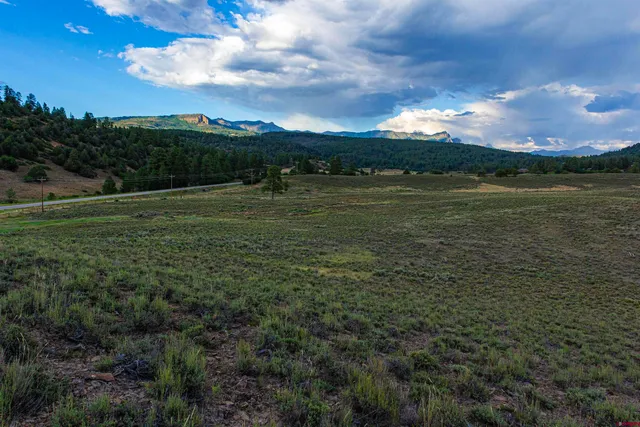 a view of a lake with a big yard