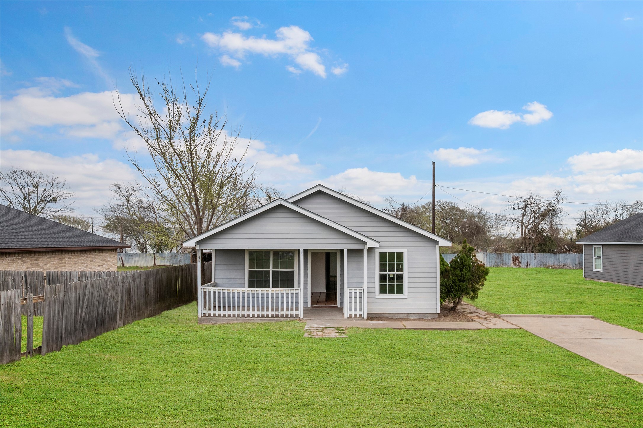 330 3rd Street Hempstead, TX 77445 - Photo 11 of 13 a front view of a house with a yard and garage