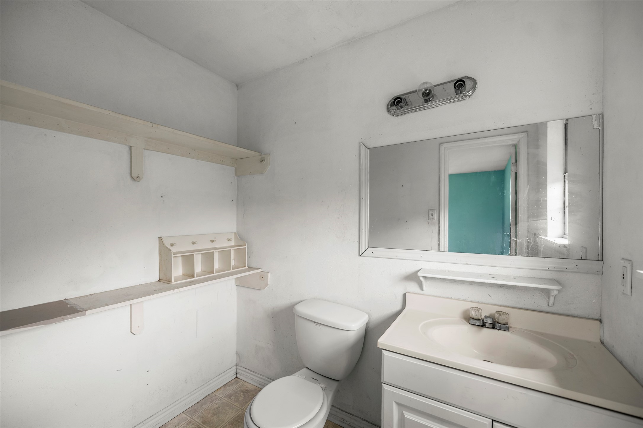 330 3rd Street Hempstead, TX 77445 - Photo 6 of 13 a bathroom with a sink and a toilet