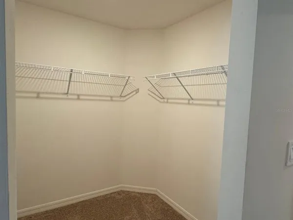 a view of a room with racks on the wall