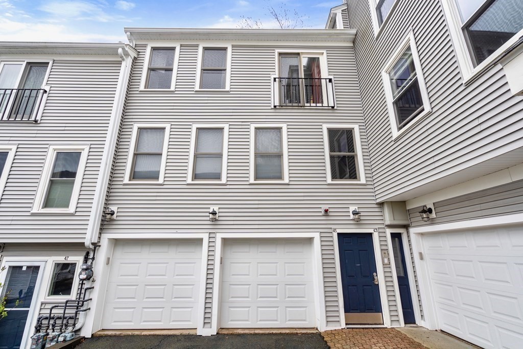 43 North Mead Street, Unit 43 Boston, MA 02129 - Photo 15 of 17 a view of a house with more windows and brick wall