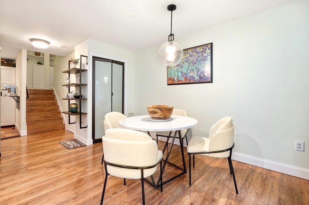 43 North Mead Street, Unit 43 Boston, MA 02129 - Photo 5 of 17 a view of a dining room with furniture and wooden floor
