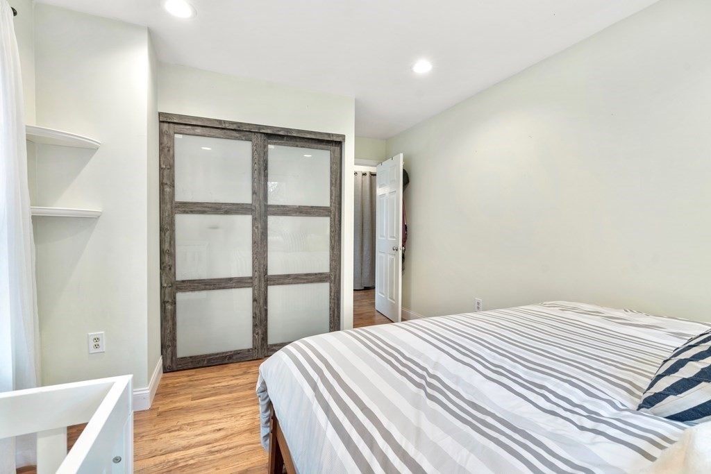 43 North Mead Street, Unit 43 Boston, MA 02129 - Photo 8 of 17 a bedroom with a bed and a window