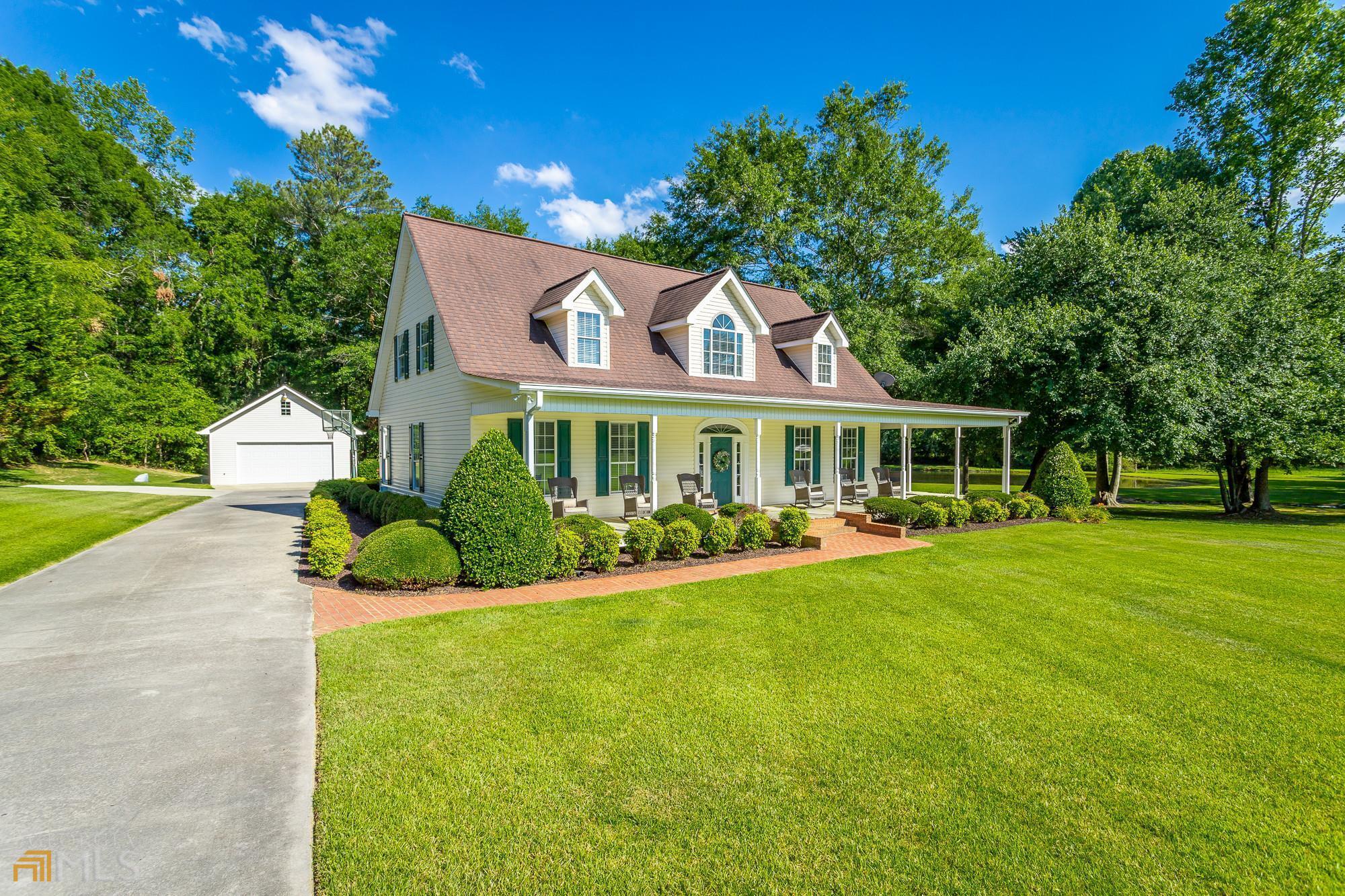 1408 Beaverdale Road Northeast Dalton, GA 30721 - Photo 1 of 1 a front view of a house with yard and green space