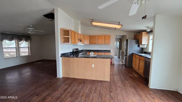 a bathroom with a granite countertop sink toilet a shower and bathtub