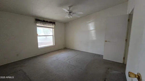 a view of empty room with windows