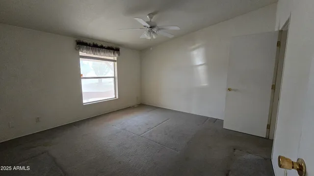 a view of empty room with windows