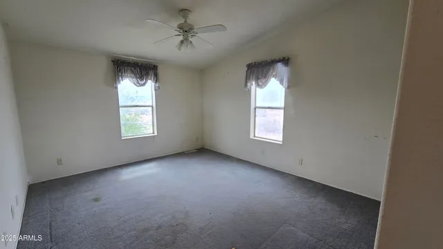 a bathroom with a sink a toilet a mirror and shower